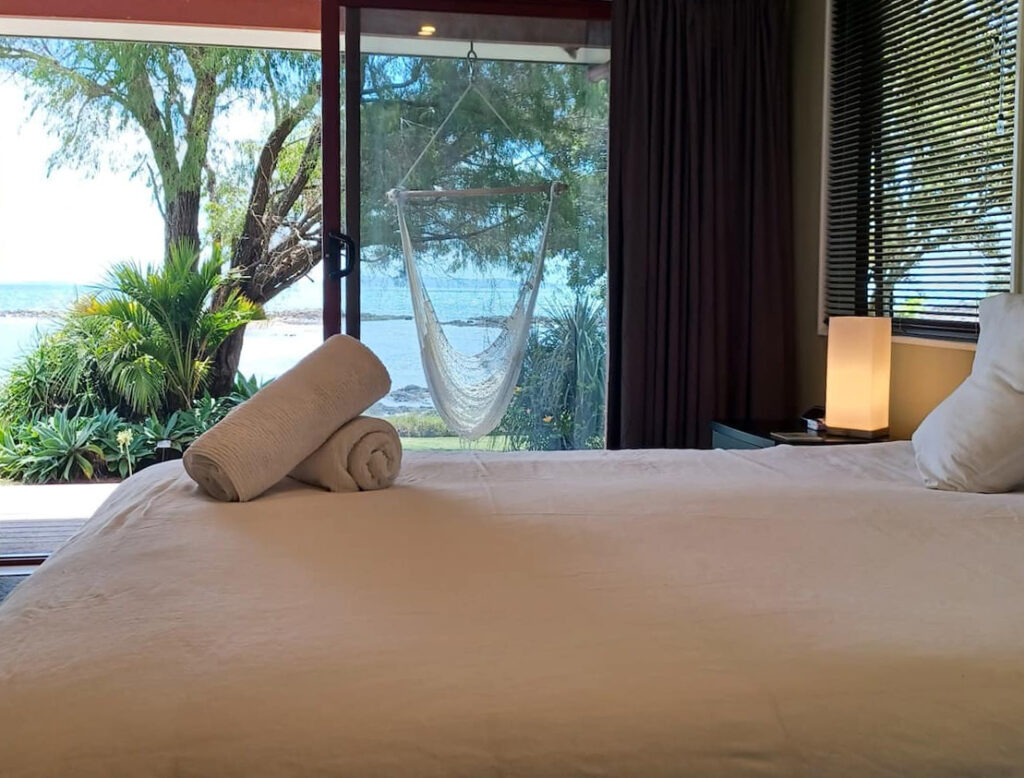 cove cottage bedroom with seaview coopers beach northland