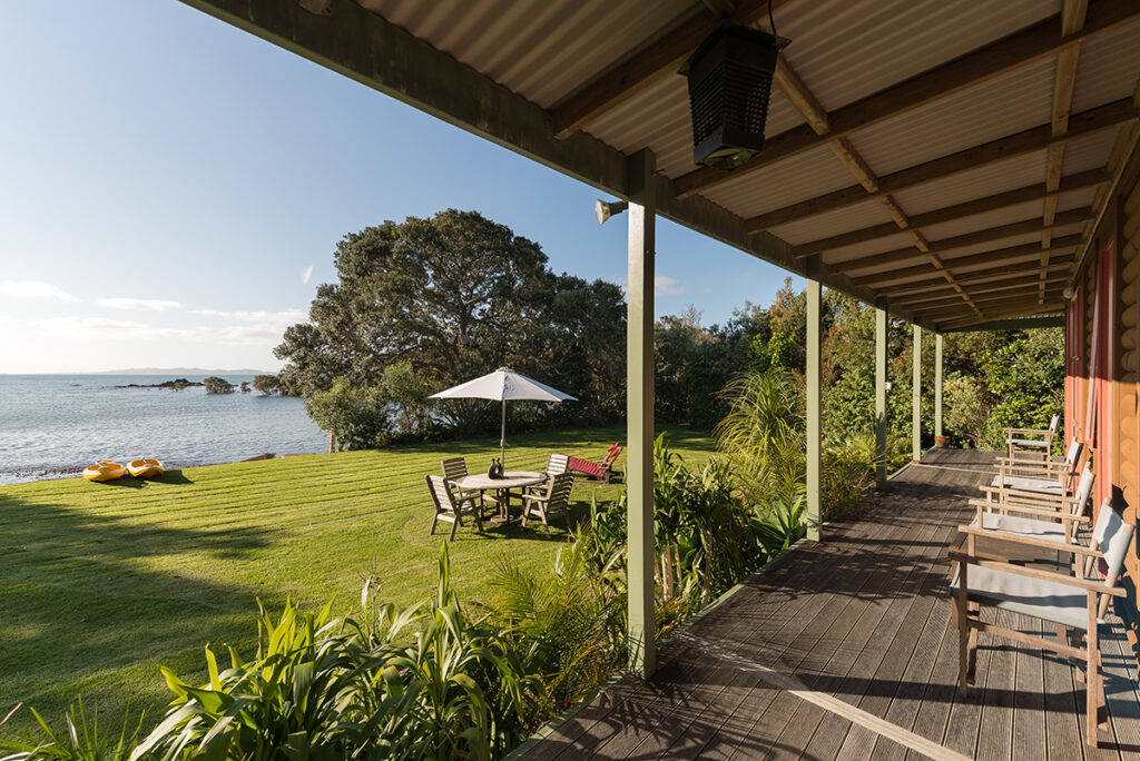 guest cottage deck, lawn and sea view