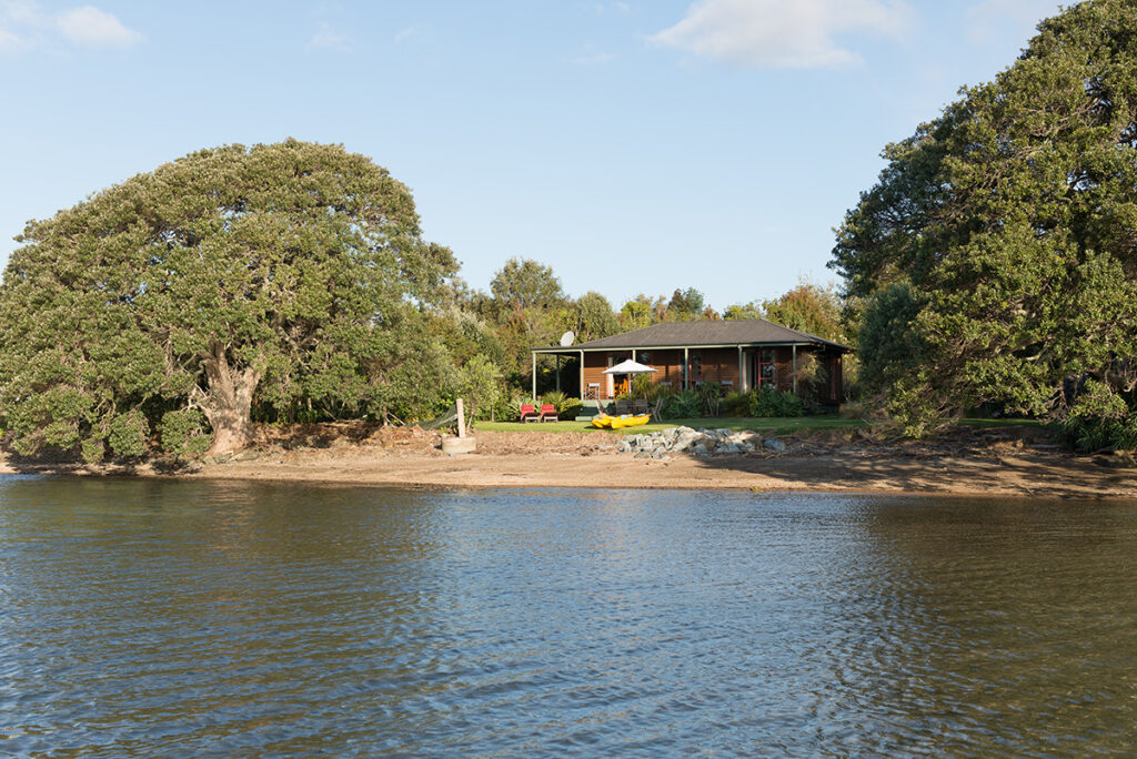view from sea towards guest cottage at sanctuary in the cove near coopers beach